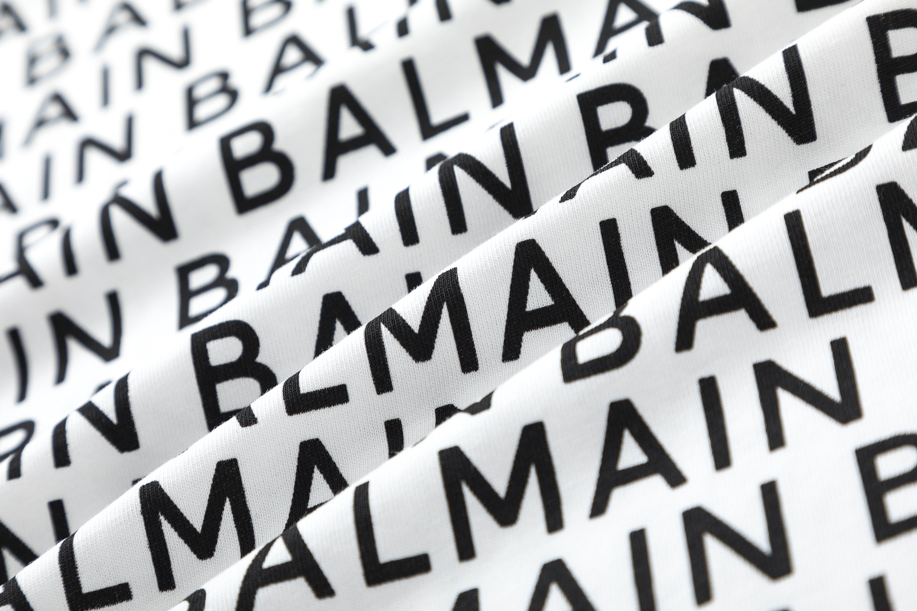 Balmain Logo Print T-shirt shown in relaxed fit and crew neck style, ideal for everyday wear and layering.