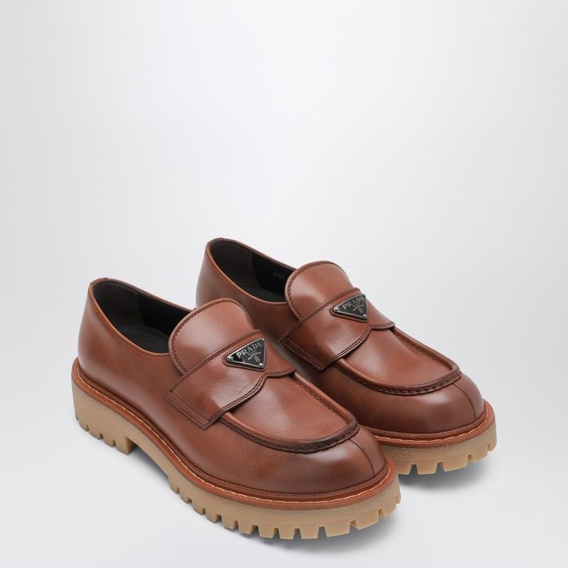 PRADA Men's Leather Loafers with Enamelled Metal Logo Strap - Banlieue91 -