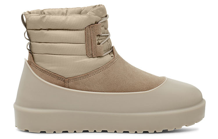 Close-up view of UGG Classic Mini Lace-Up Weather Boot 'Dune' with plush sheepskin lining for warmth and comfort.
