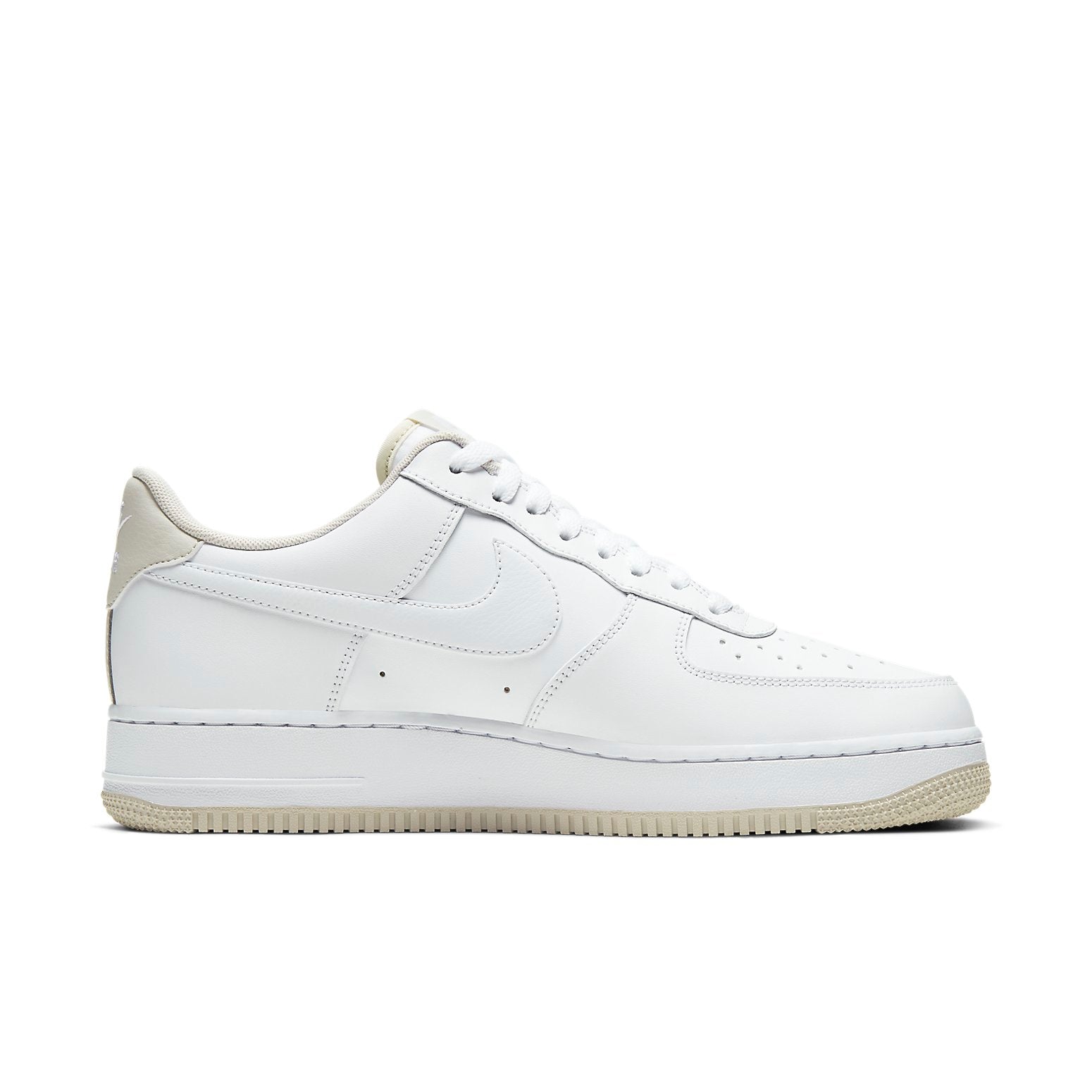 Close-up view of the Nike Air Force 1 Low 'White Light Bone' showcasing the iconic Nike Swoosh and smooth leather detailing.