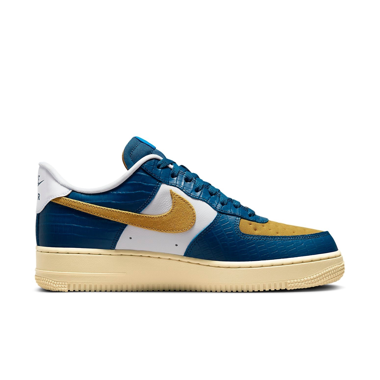 Close-up view of Nike x Undefeated Air Force 1 Low SP 'Dunk vs AF1' highlighting premium suede, smooth leather, and patent leather materials.