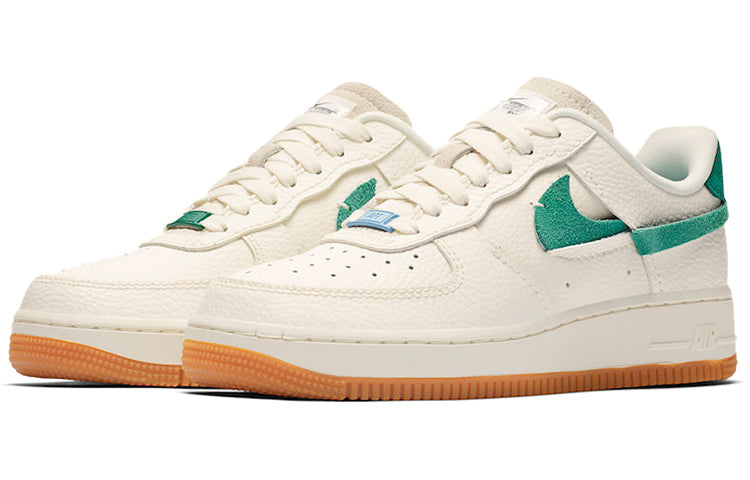 Close-up of the Nike Air Force 1 Vandalized 'Green' highlighting the tumbled leather and suede split Swoosh detail.