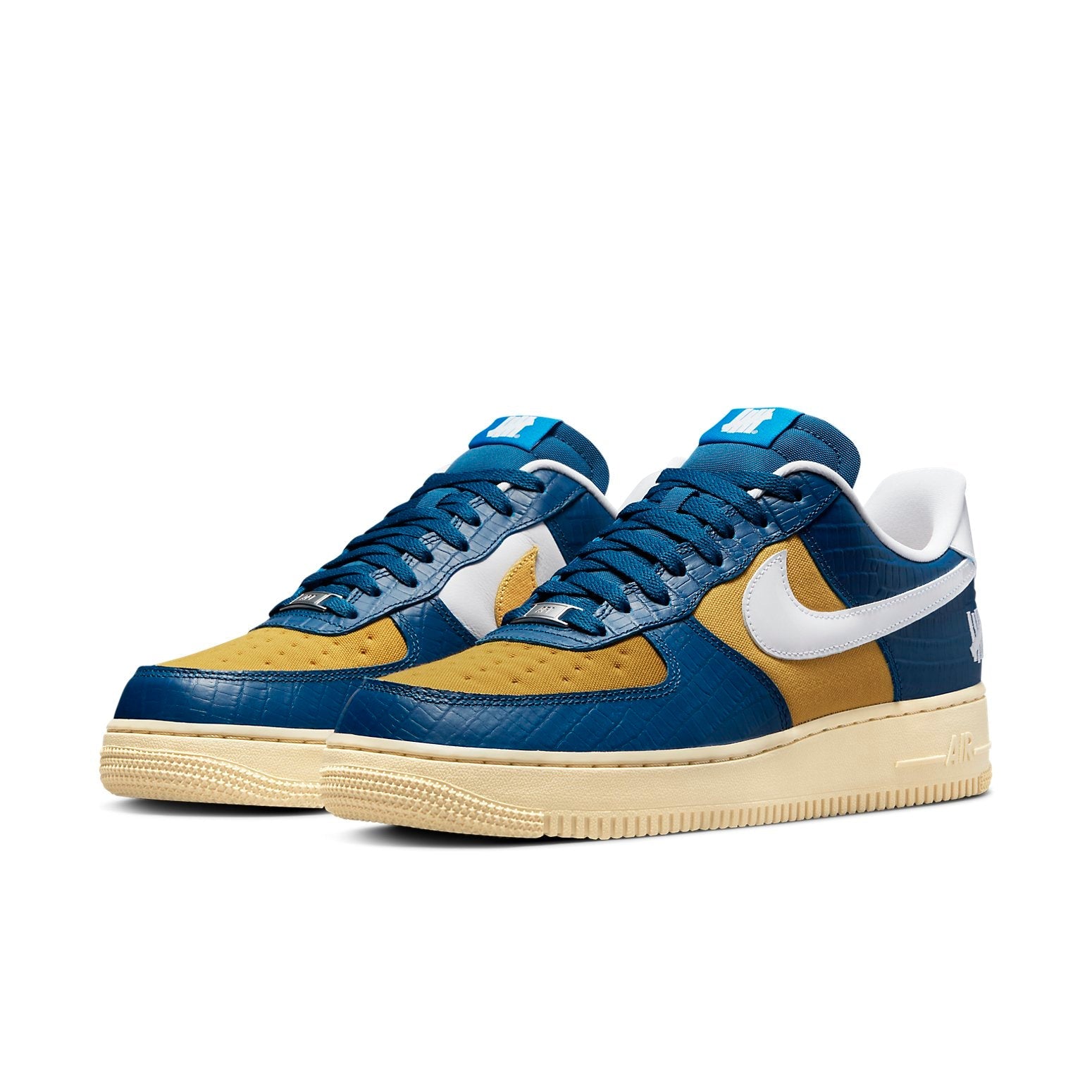 Nike x Undefeated Air Force 1 Low SP 'Dunk vs AF1' featuring vibrant blue and yellow color scheme with a crocodile skin pattern.