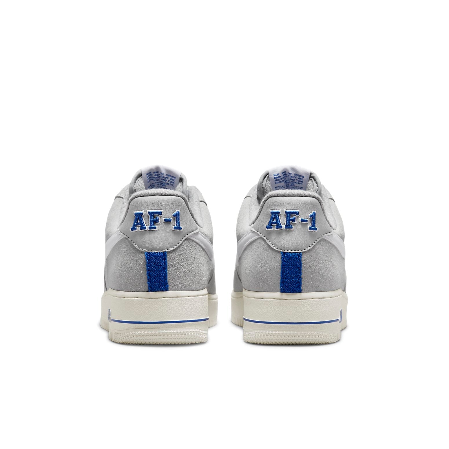 Close-up view of Nike Air Force 1 Low 'Athletic Club White' with detailed suede texture and iconic white leather swoosh, perfect for athletic style.