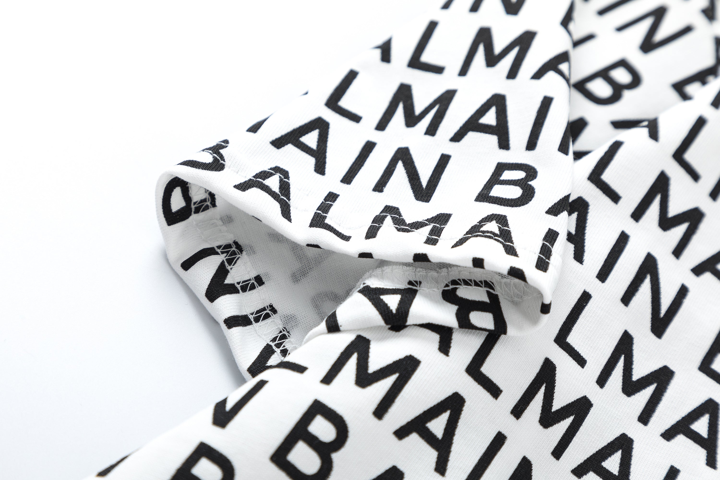 Balmain Logo Print T-shirt featuring bold logo design on high-quality cotton fabric, perfect for casual streetwear.