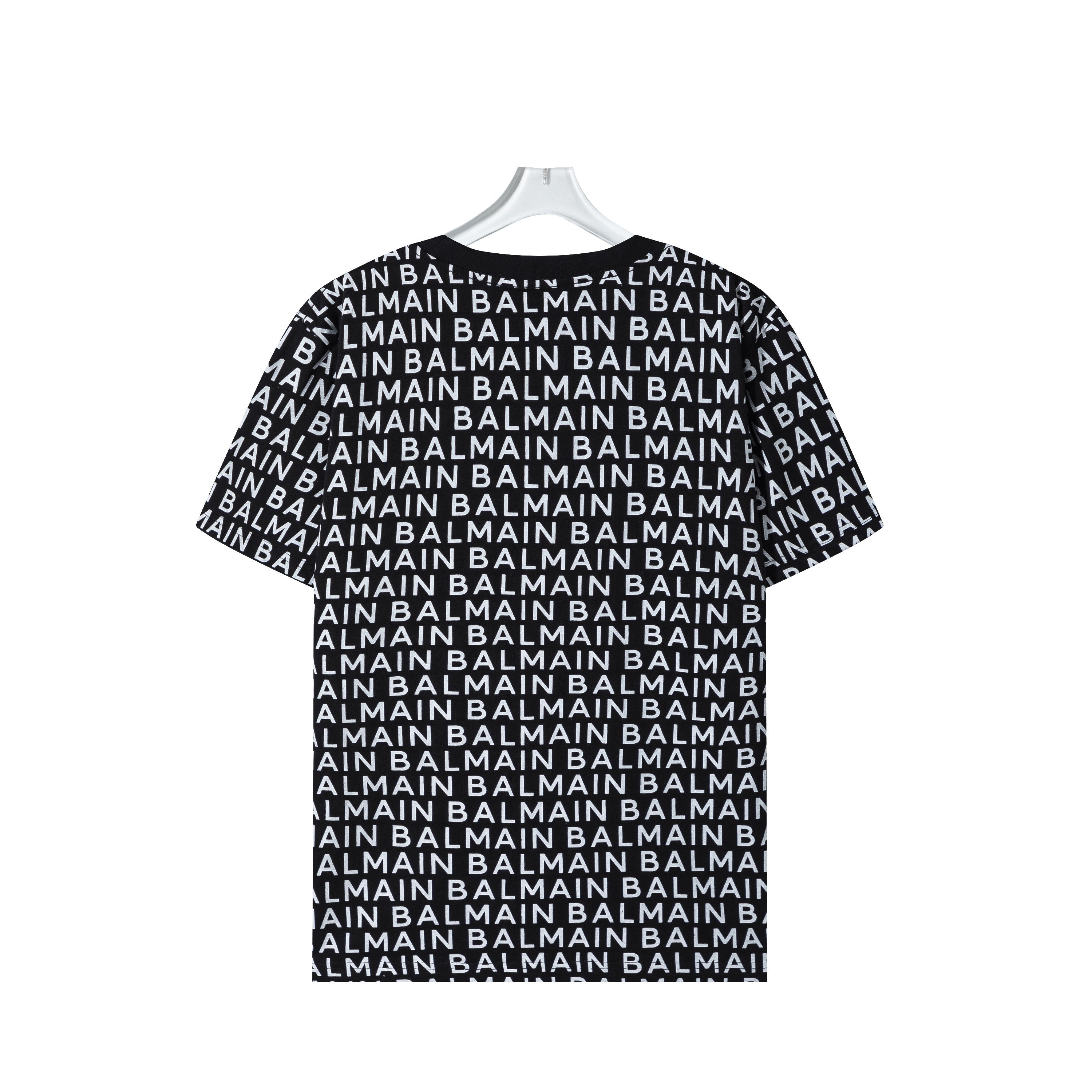 Black t-shirt with Balmain logo pattern on a