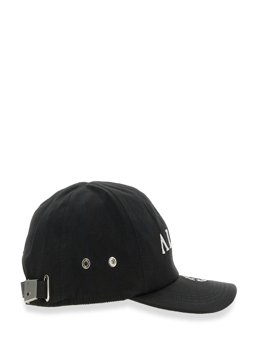 Black adjustable baseball cap with side metal eyelets and embroidered front lettering