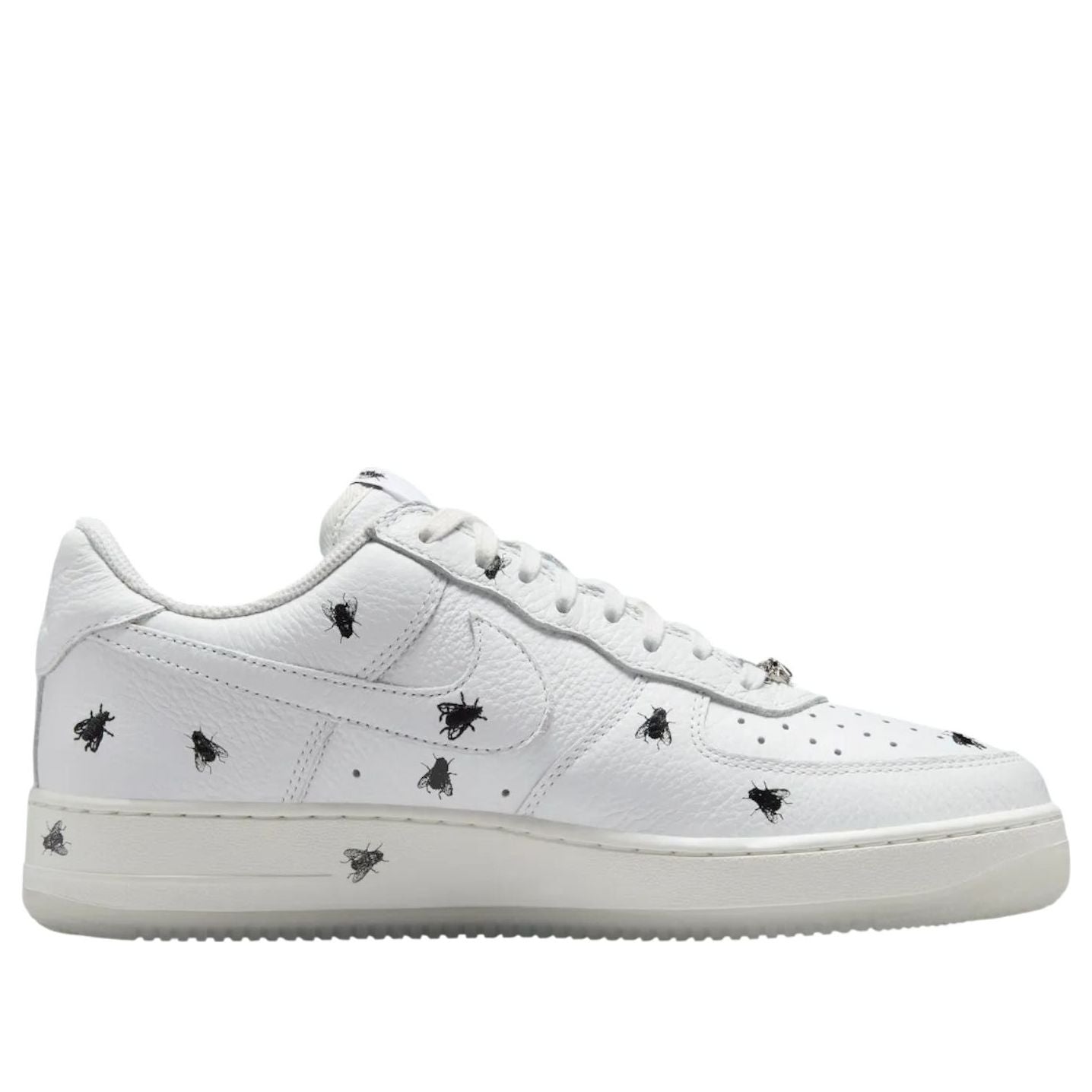 Sneaker close-up of Nike Air Force 1 Low 'Houseflies' showcasing the tumbled leather upper adorned with housefly patterns.