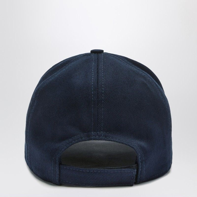 Back view of a navy blue baseball cap with adjustable strap on white background