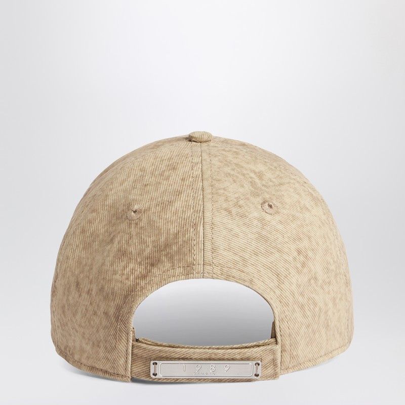Rear view of beige corduroy baseball cap with adjustable strap and metal plate detail