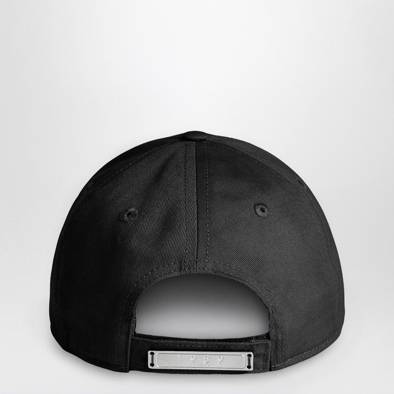 Back view of black adjustable baseball cap with metal strap and '1989' engraving