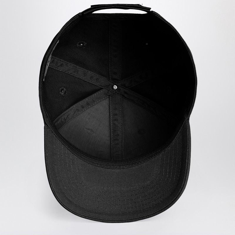 Inside view of black baseball cap with curved brim and stitching details
