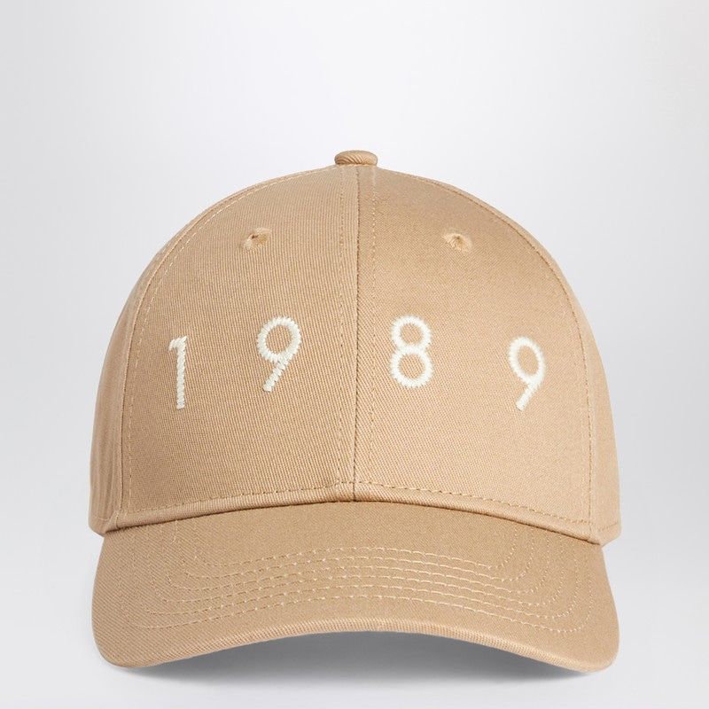 Beige baseball cap with white embroidered 1989 on the front, fashion accessory