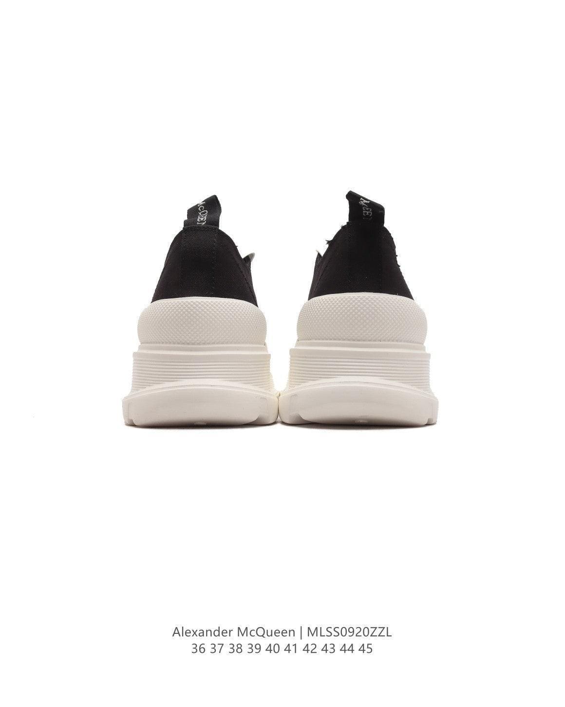 Alexander McQueen Women Tread Slick lace-up Sneakers 'Black/White' | Banlieue91