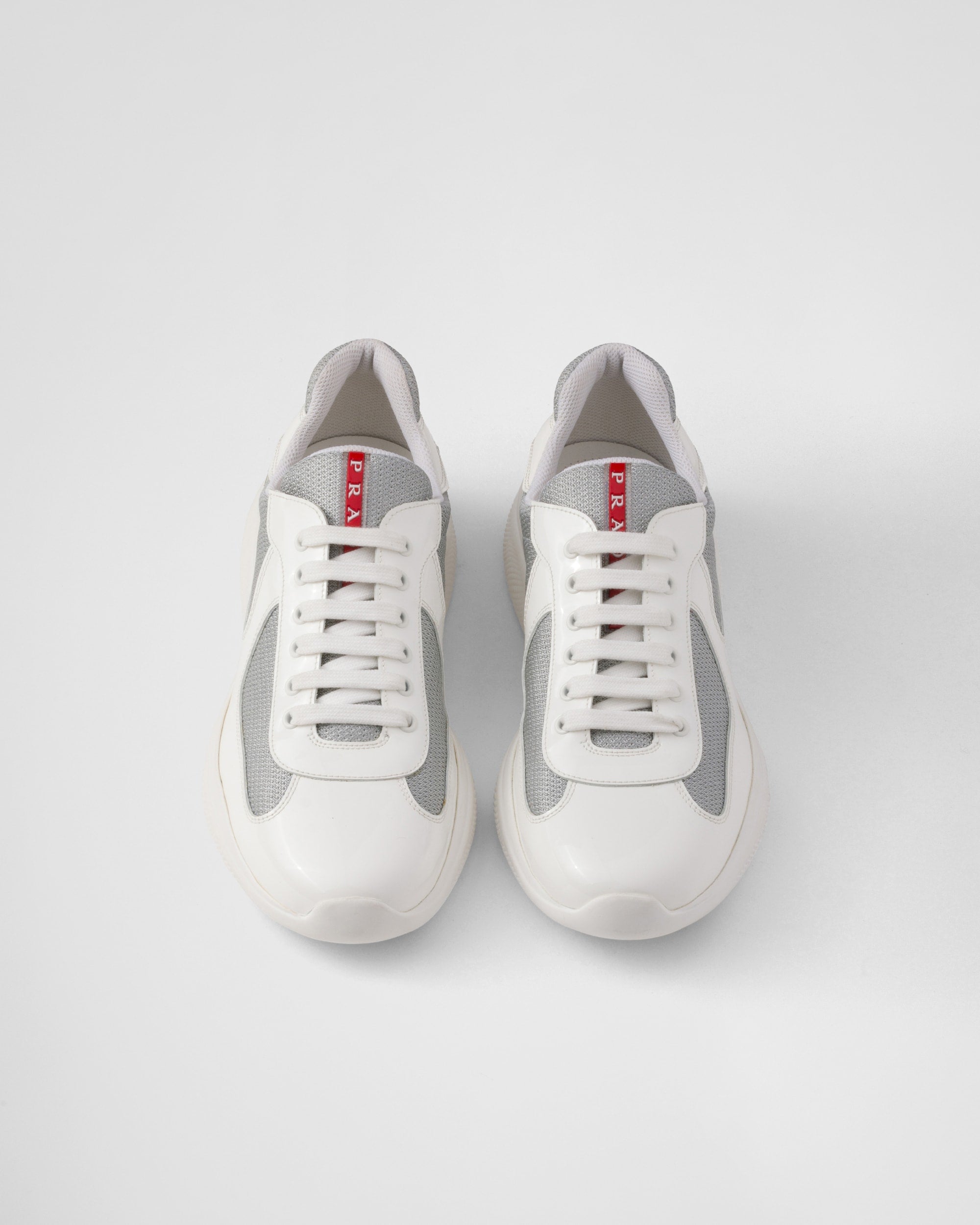 White and gray sneakers on a light gray background