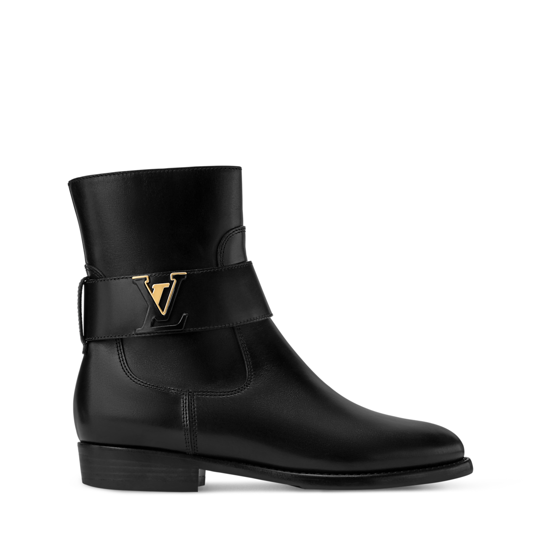 Louis Vuitton Midtown Flat Ankle Boot crafted from supple calf leather with decorative strap and gold-toned LV initials.