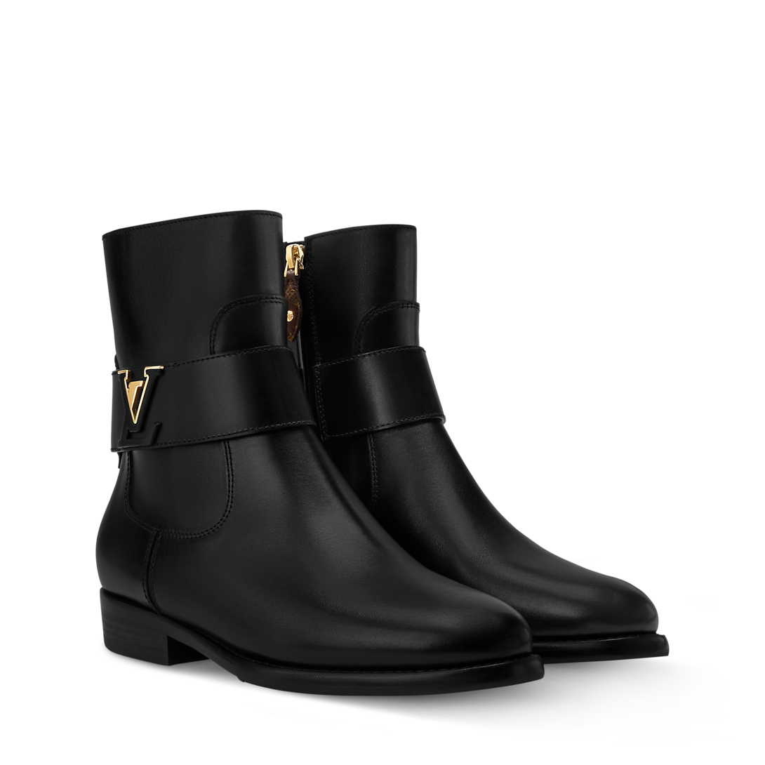 Close-up of the Louis Vuitton Midtown Flat Ankle Boot showing the side zip and signature hardware detailing.