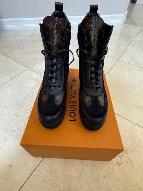 Back view of Louis Vuitton Laureate Platform Desert Boots featuring Monogram canvas detail on the back loop.