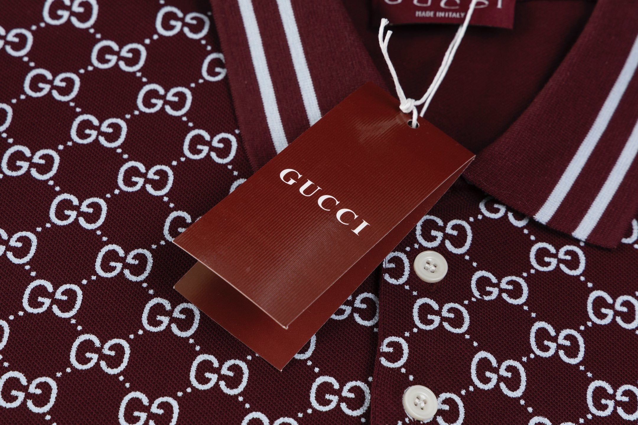 Model wearing the Gucci T-shirt with a collar, highlighting its versatility paired with jeans for a chic outfit.