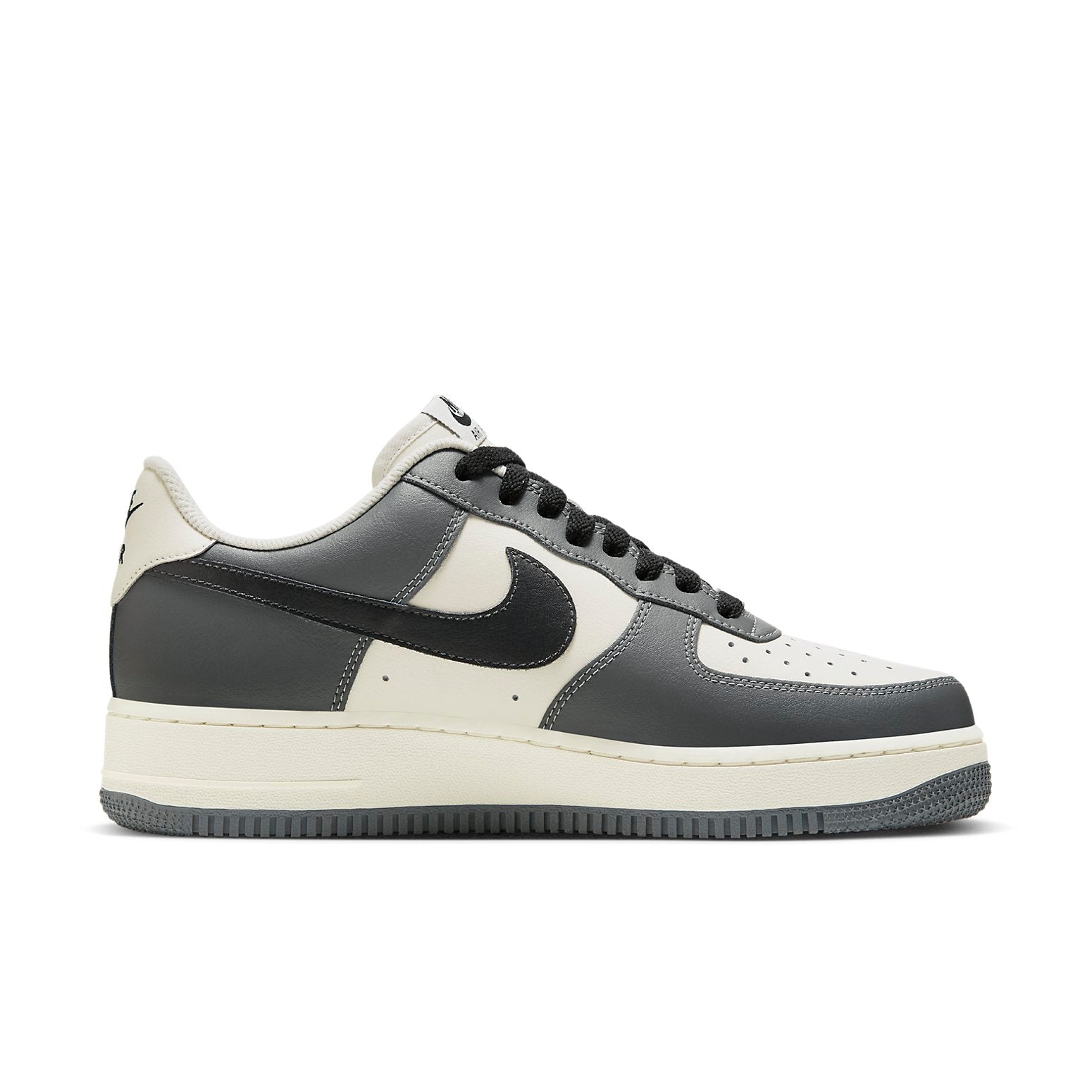 Close-up view of the Nike Air Force 1 Low 'Grey White', featuring its signature grey and white colorway and classic silhouette.
