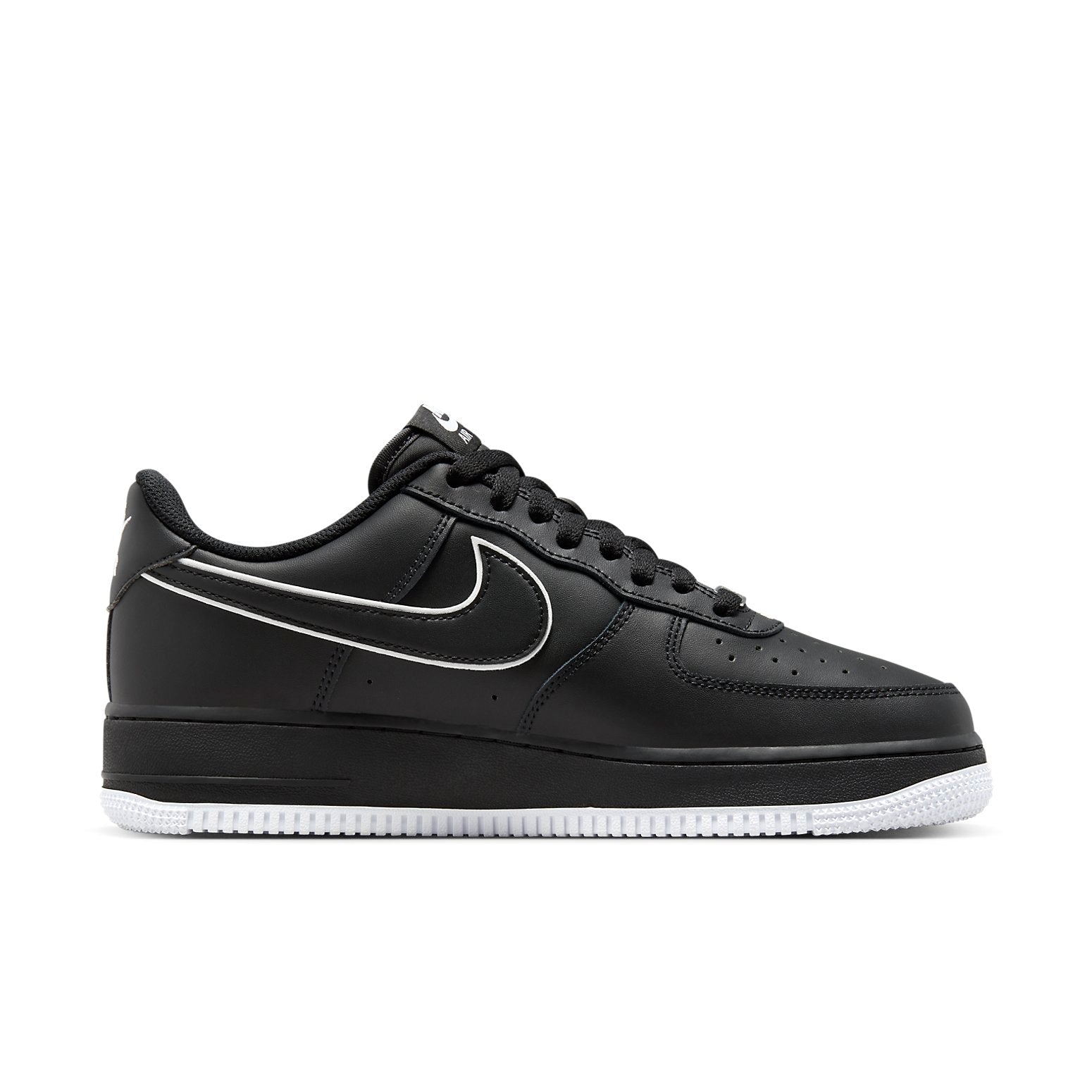 Close-up of Nike Air Force 1 Low '07 Black White Sole (2023) featuring bold black and white color contrast with perforated toebox.