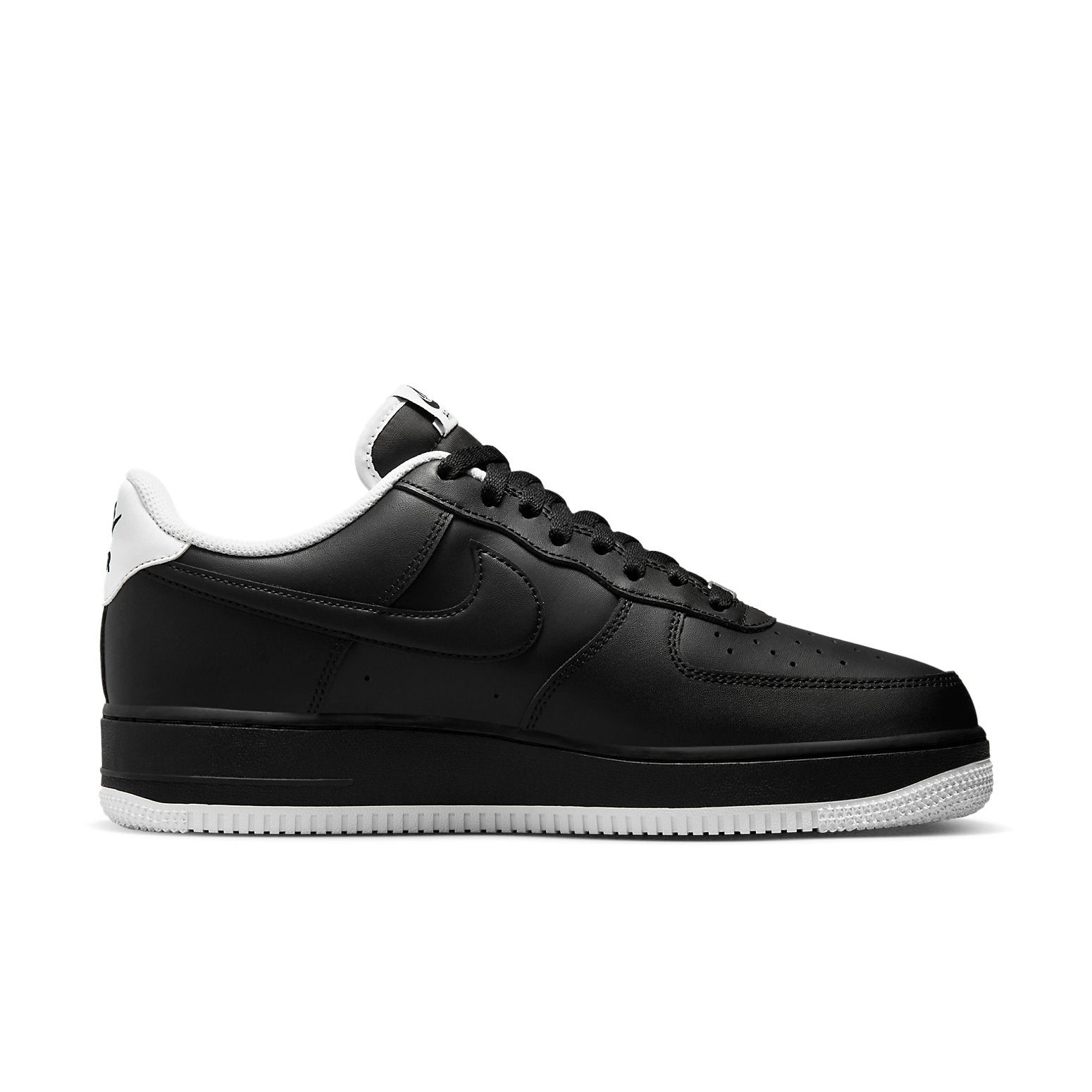 Stylish Nike Air Force 1 '07 'Black White' sneaker featuring a close-up of the pale ivory details and iconic silhouette.