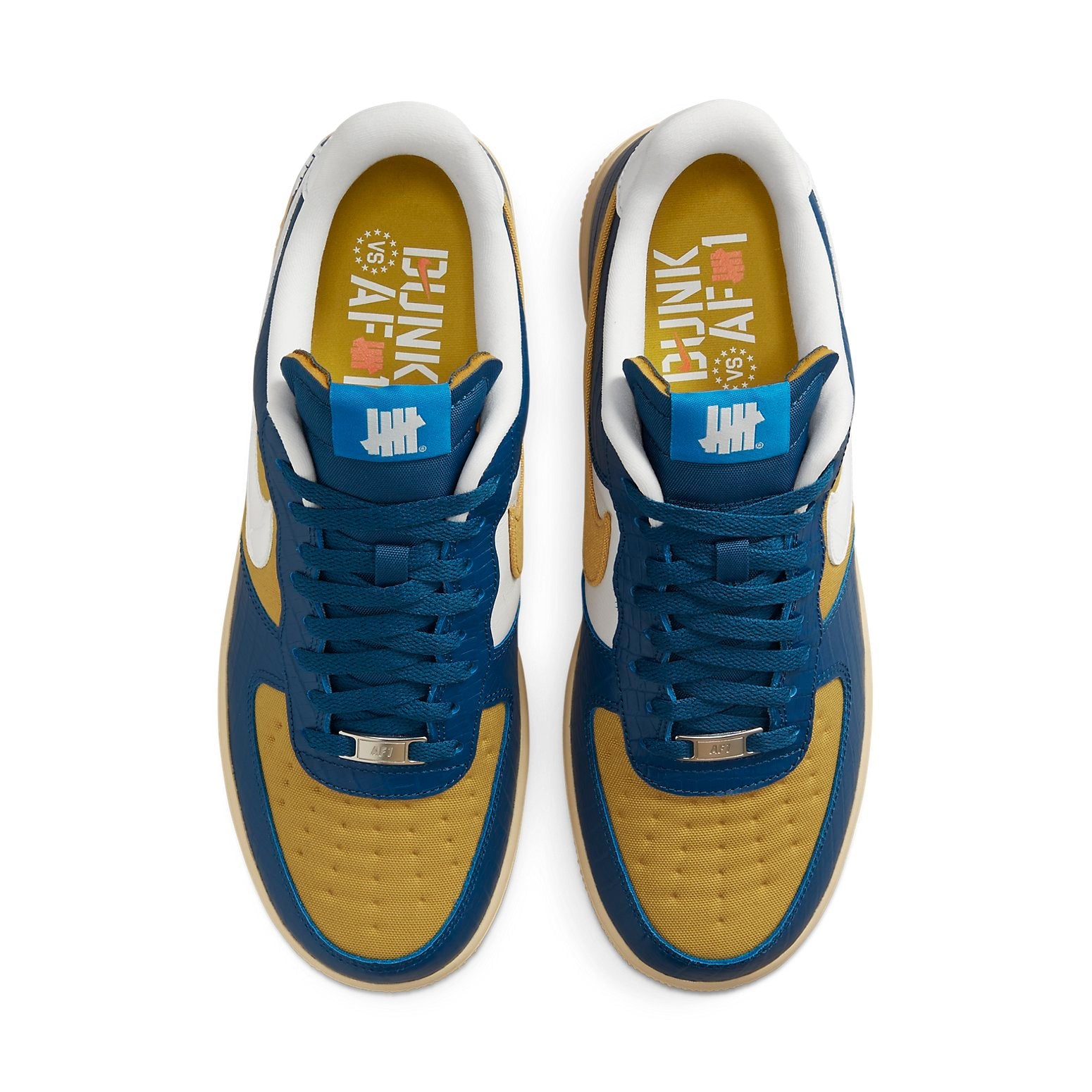 Close-up of the Nike x Undefeated Air Force 1 Low SP 'Dunk vs AF1' showing premium suede and smooth patent leather materials.