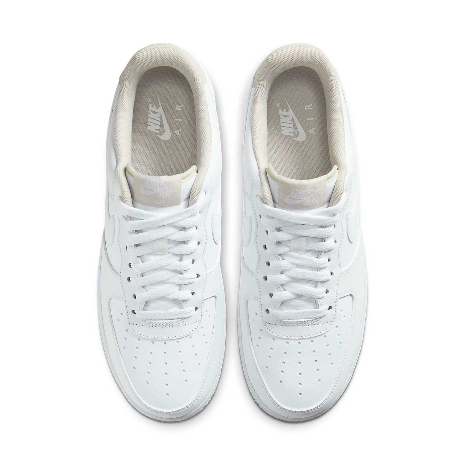 Top-down view of the Nike Air Force 1 Low 'White Light Bone' featuring white laces and seamless leather construction.