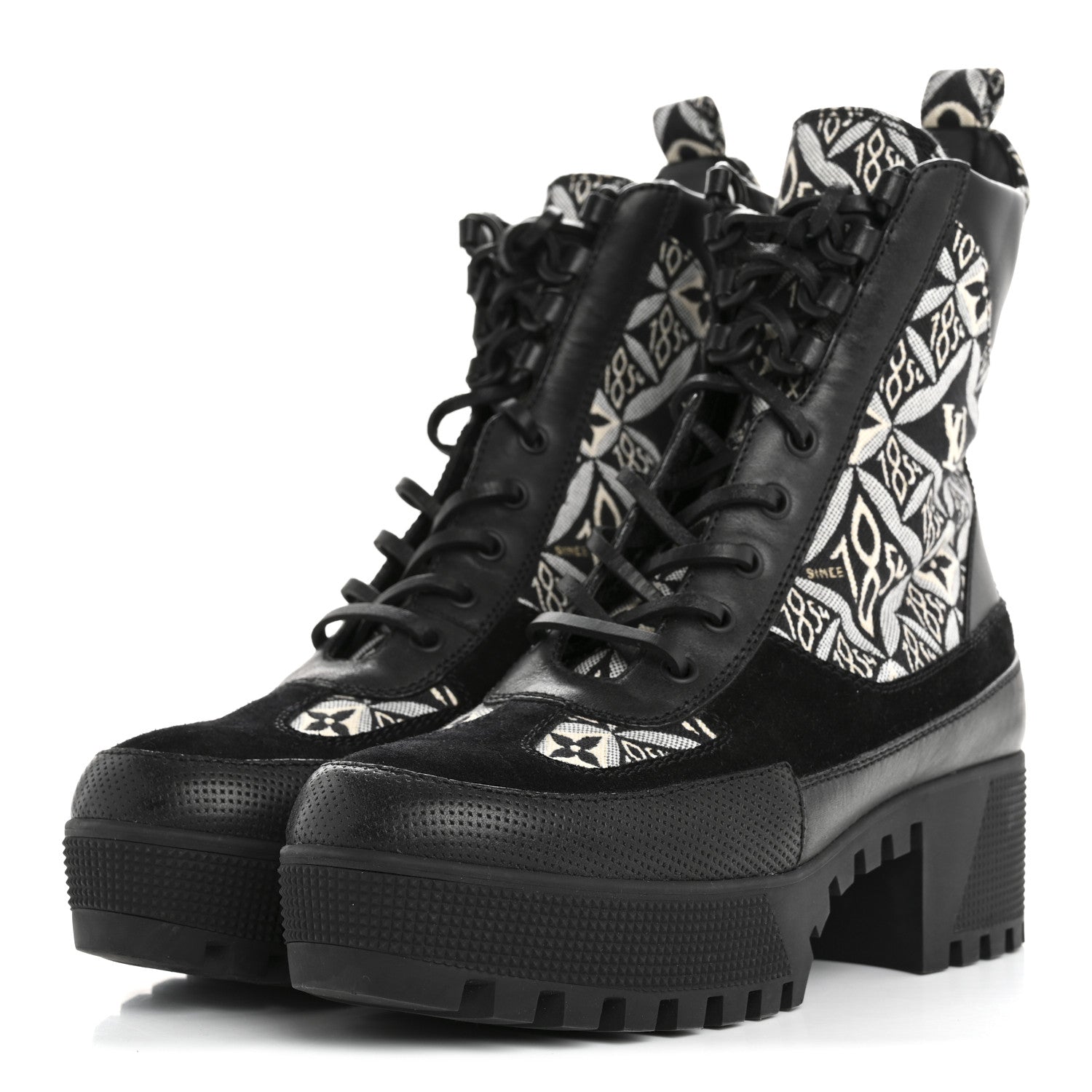 Close-up of Louis Vuitton Laureate Platform Desert Boots featuring Monogram canvas back loop and stylish detail.