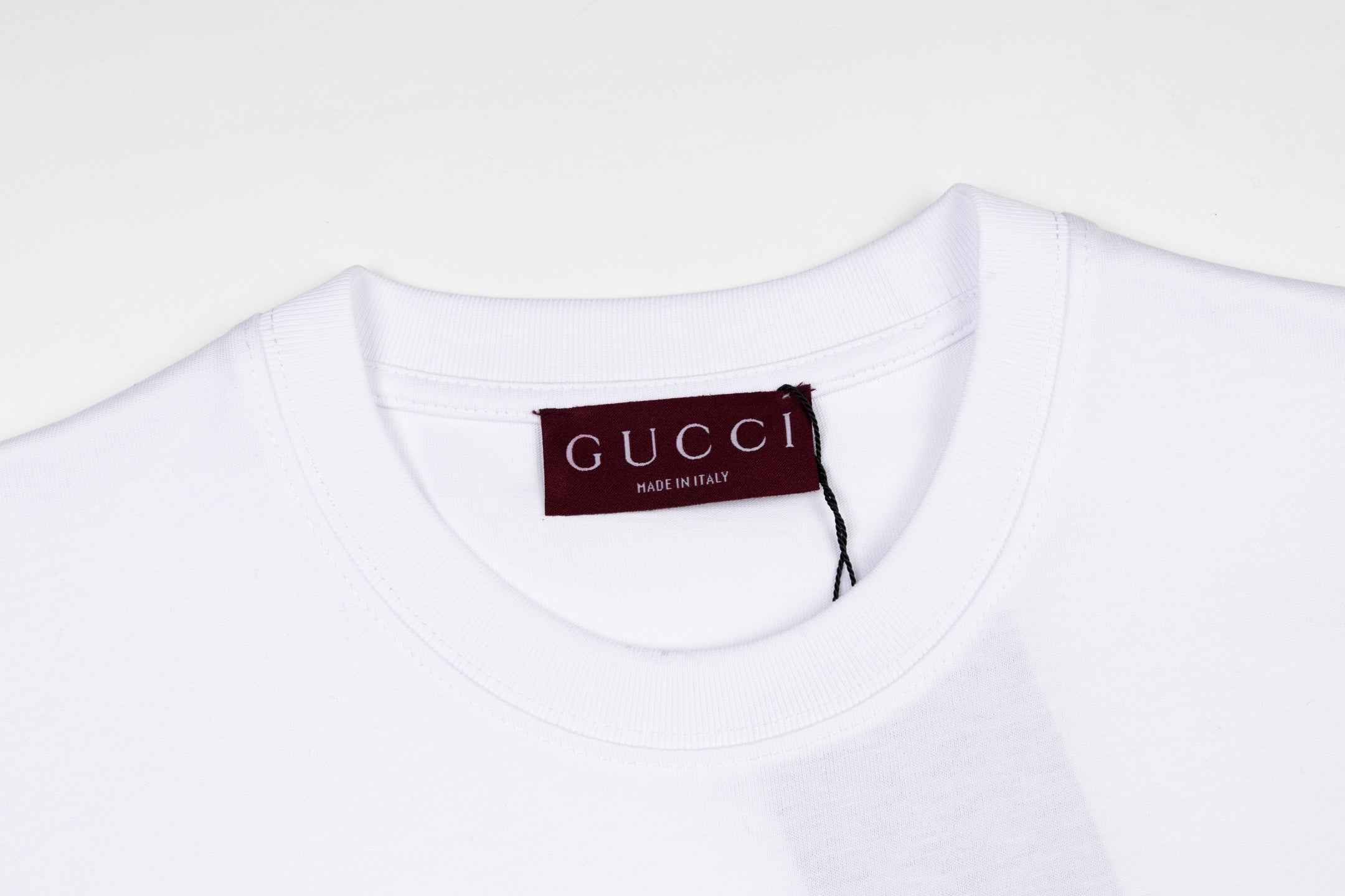 Gucci T-Shirt Without Collar in White, showcasing premium cotton fabric and minimalist design, perfect for casual and stylish looks.