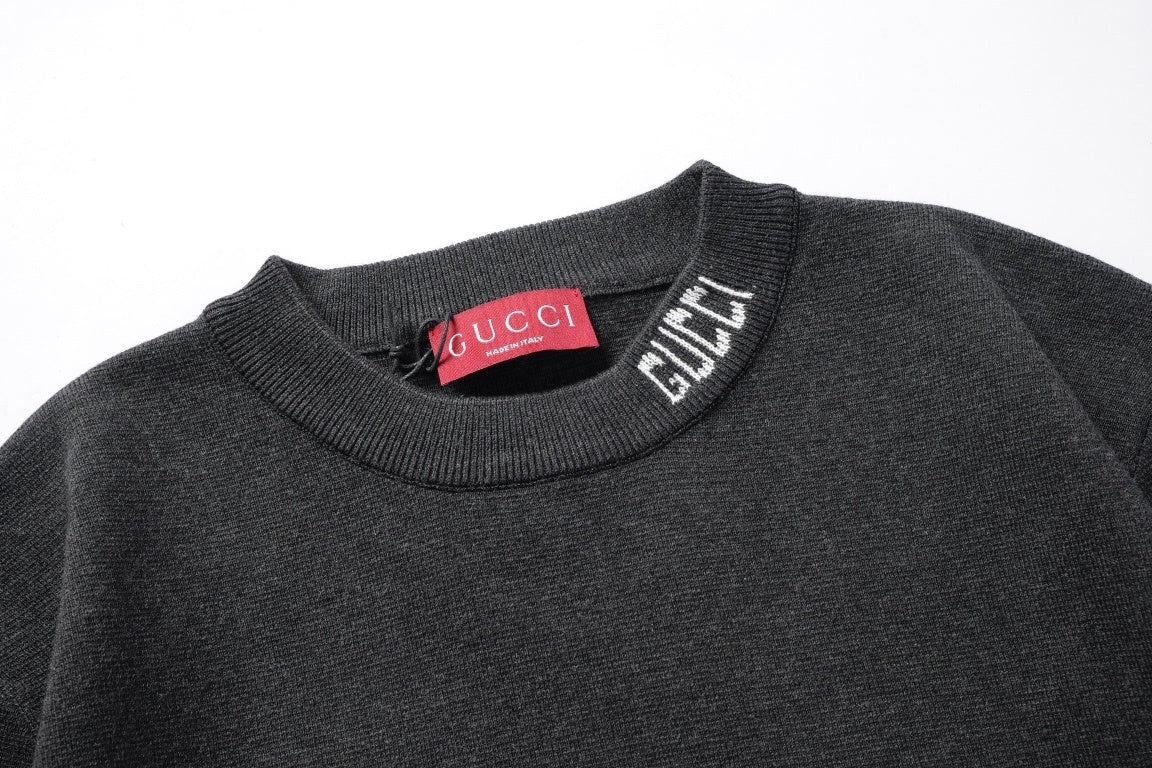Gucci T-Shirt Without Collar 'Black' styled with jeans, exemplifying a casual yet sophisticated fashion look.