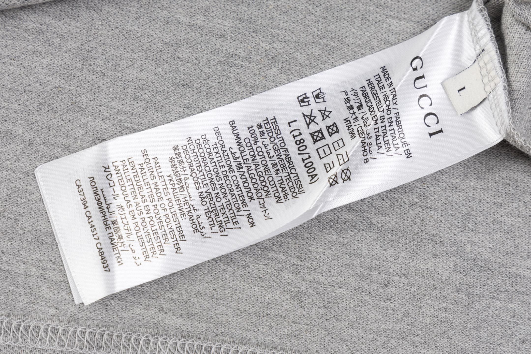 Gucci T-shirt with a collar showcasing its stylish design, crafted from premium cotton for a blend of casual and luxury fashion.