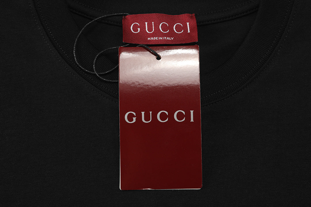 Model wearing Gucci T-Shirt Without Collar 'Black' paired with jeans, demonstrating versatility and effortless sophistication.