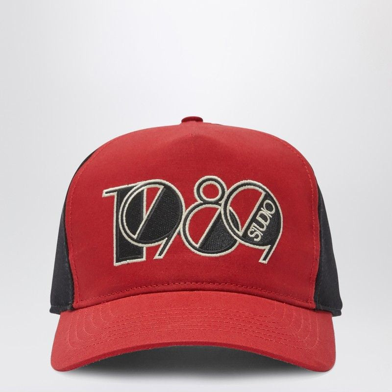 Red and black baseball cap with 1980 Studio embroidered on front