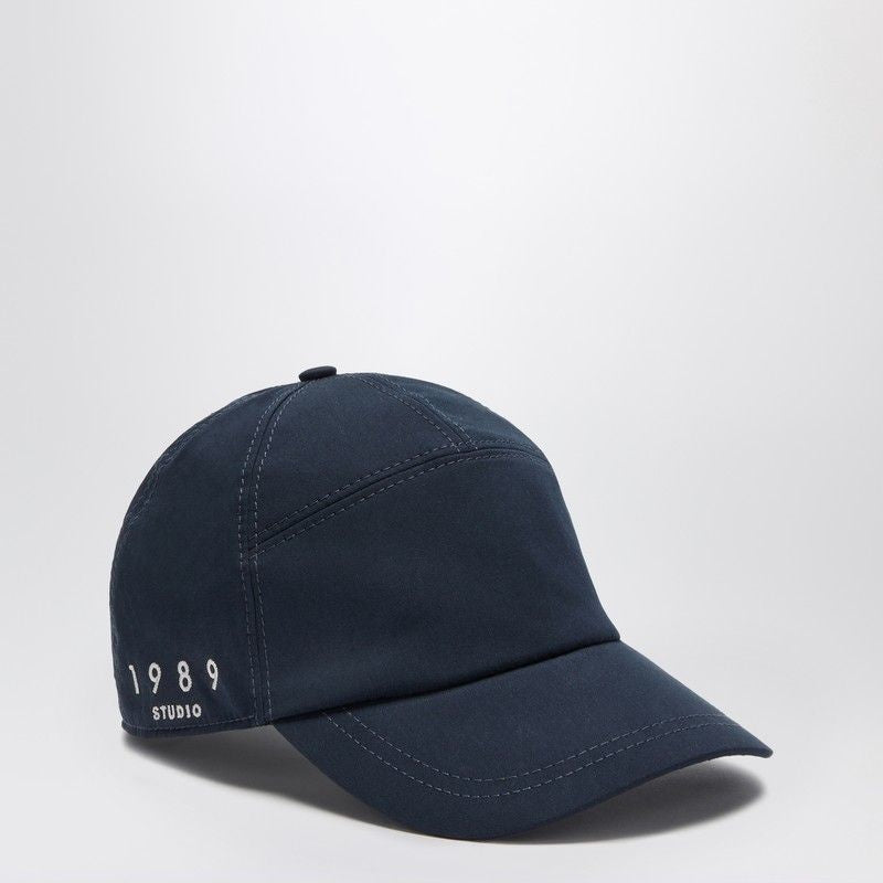 Navy blue baseball cap with '1989 Studio' embroidered on the side, stylish casual accessory