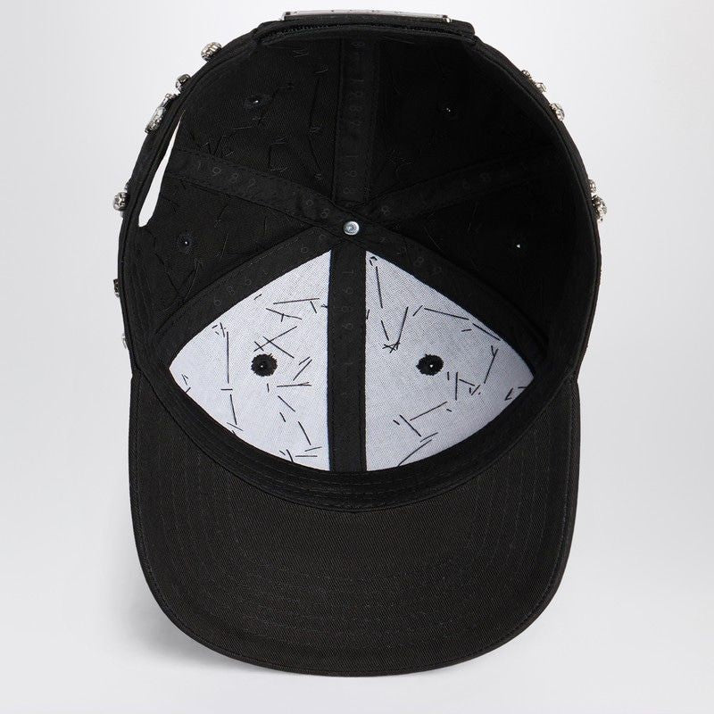 Inside view of a black baseball cap with white panel lining and visible stitching