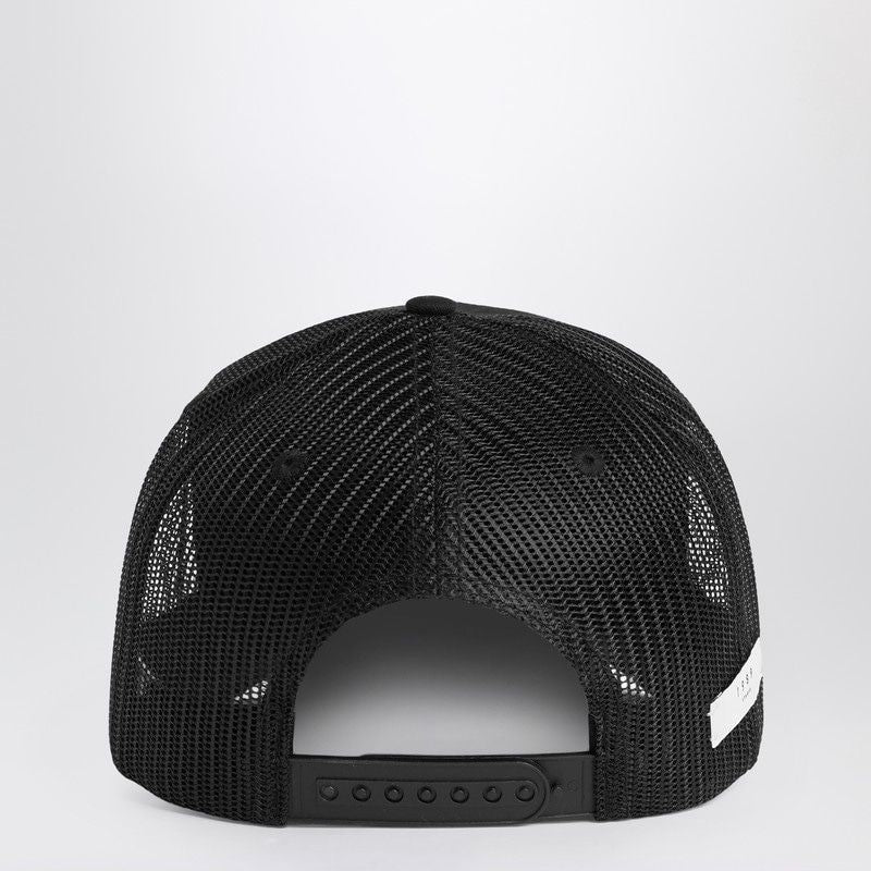 Back view of black mesh trucker cap with adjustable snapback closure