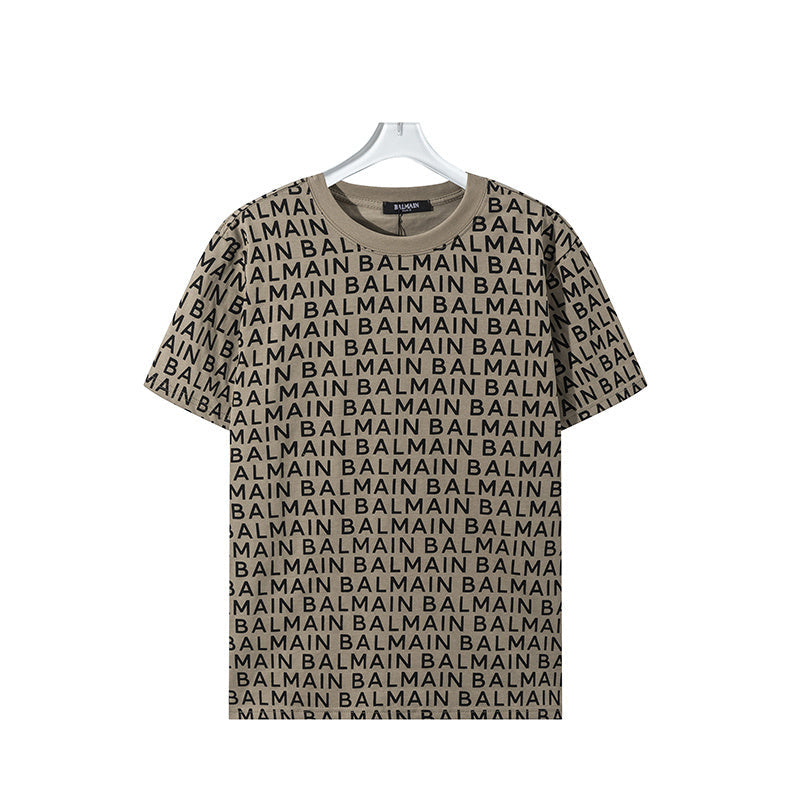 Beige t-shirt with Balmain logo pattern on a hanger