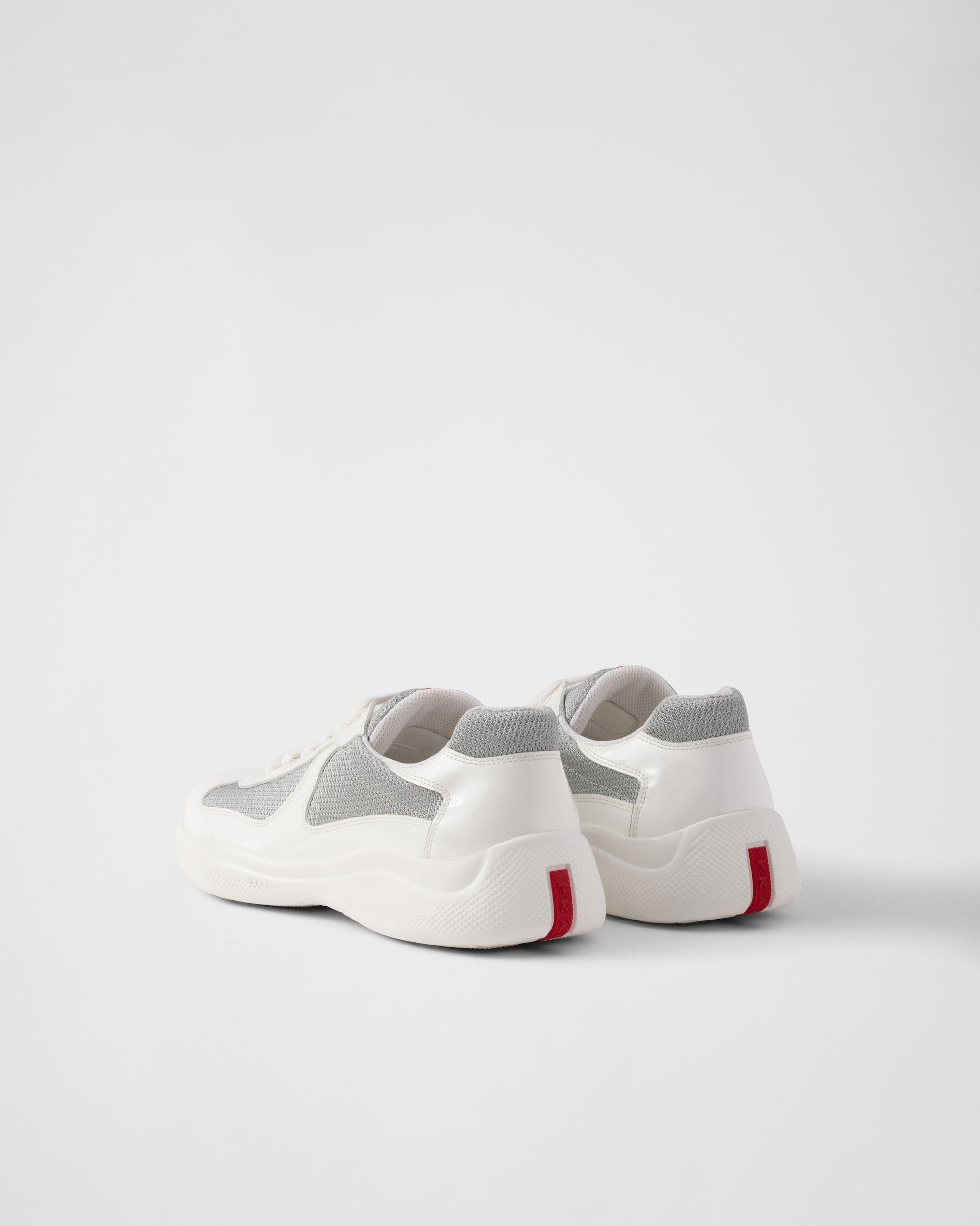 White and gray sneakers on a light gray background